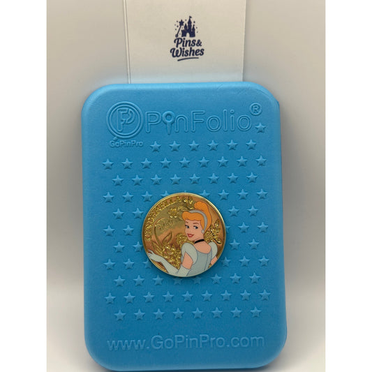 Cinderella Boxlunch Pin on a blue background pin board with Pins and Wishes Logo