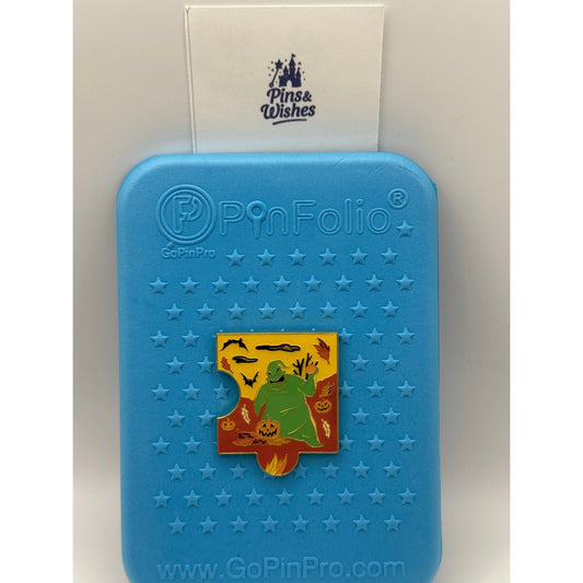 Disney The Nightmare Before Christmas Fall Characters Puzzle - Oogie Boogie On a blue background pin board with pins and wishes logo
