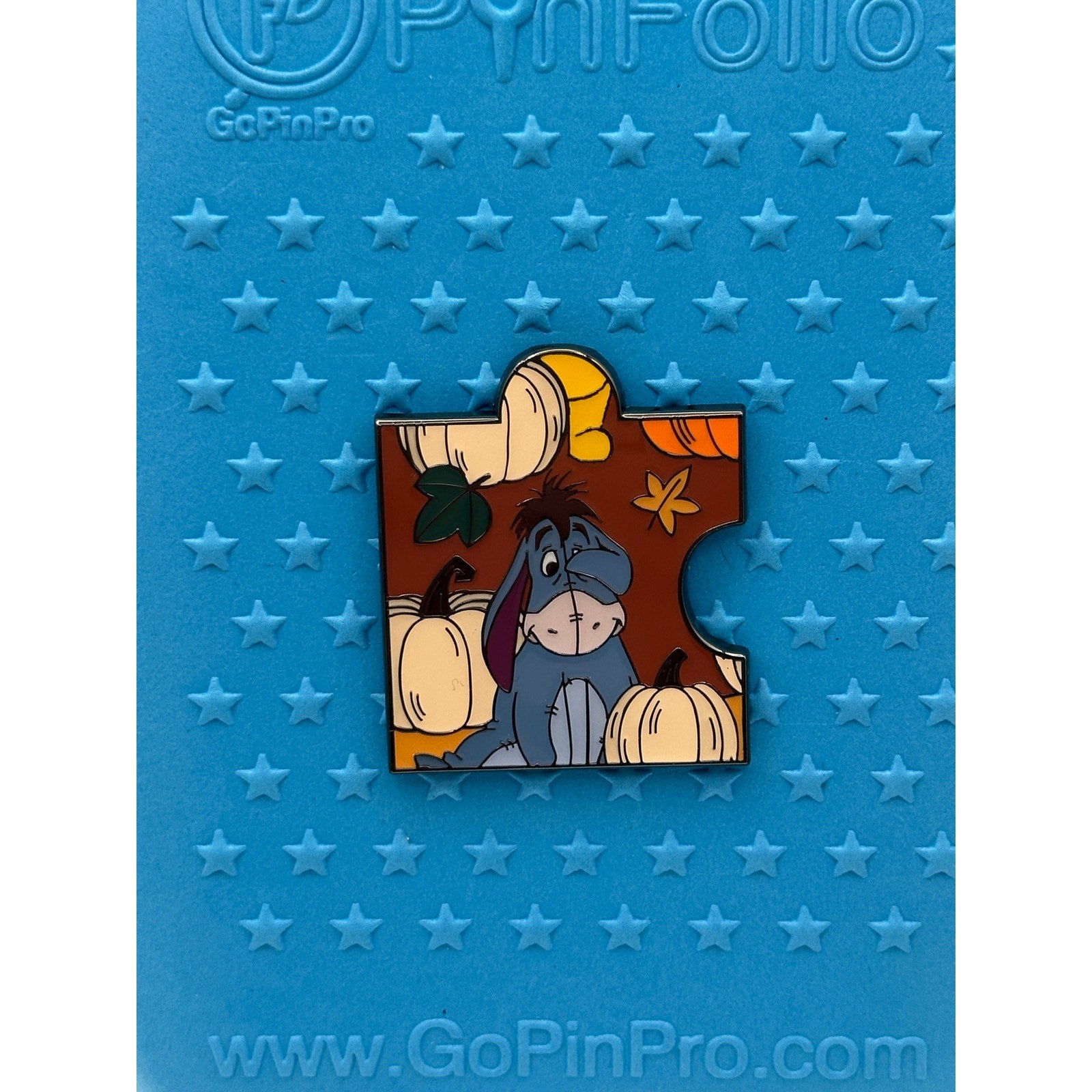 Loungefly Disney Winnie the Pooh Autumn Puzzle Blind Box Enamel Pin - Eeyore on a Blue Background Pin Board from Pins and Wishes